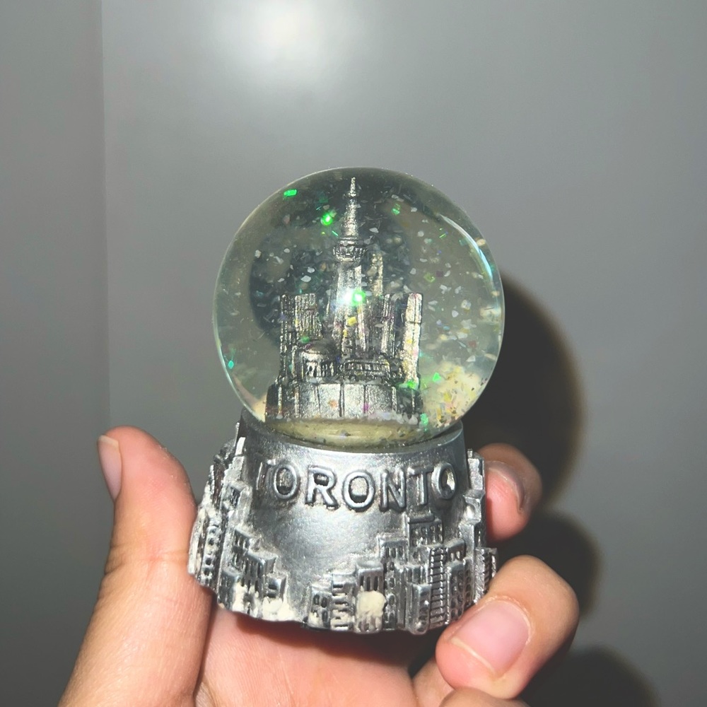 Beautiful Toronto Skyline Globe with Snowflakes floating inside